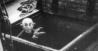 1) Nosferatu⁤ (1922) ‍- This silent film set the standard for ⁣cinematic vampire lore with its eerie atmosphere ⁢and ⁤iconic‌ imagery, featuring Max Schreck as‌ Count Orlok, a creature that embodies⁣ pure fear and⁣ dread